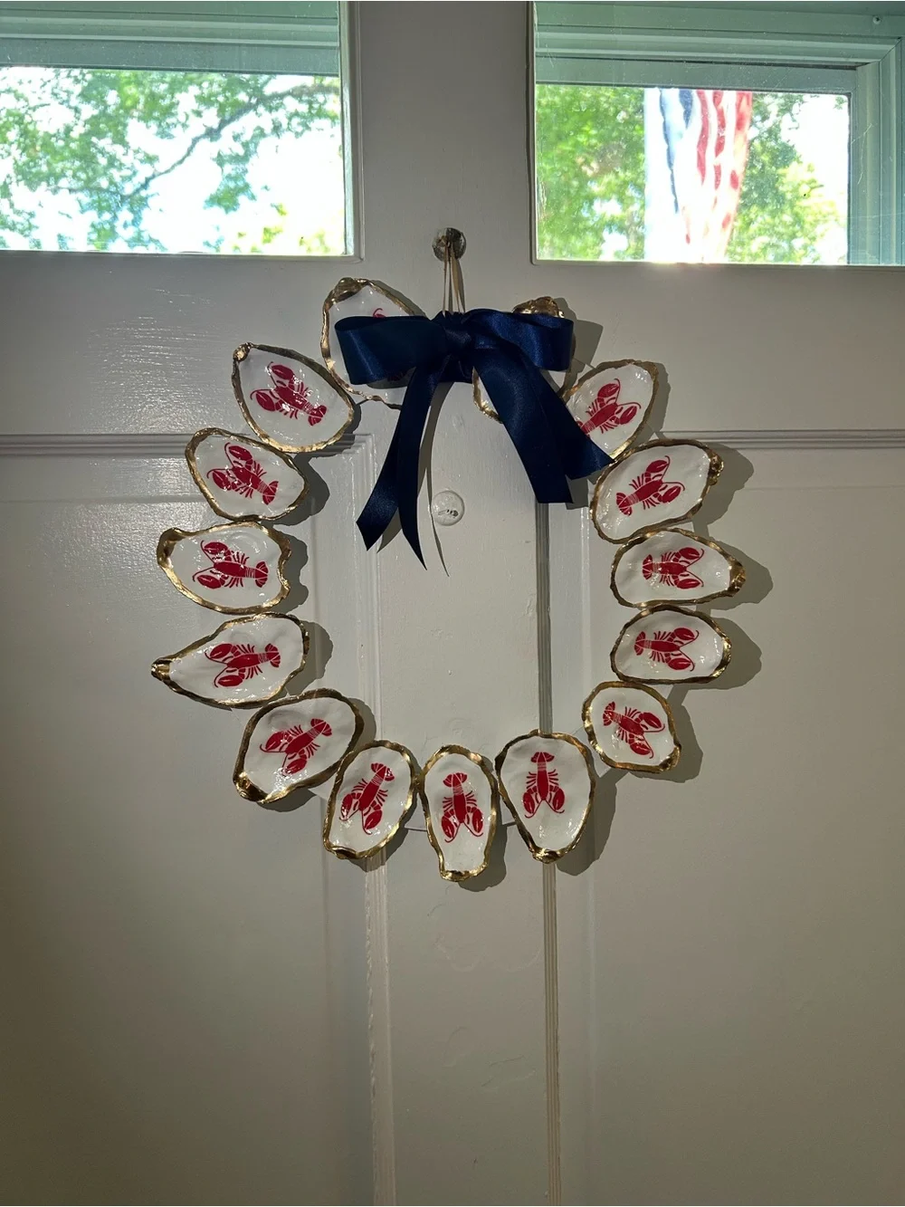 Handcrafted Oyster Shell Wreath with Red Lobster Motif and Navy Bow